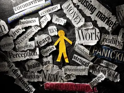 man surrounded by Coronavirus and stressful news headlines