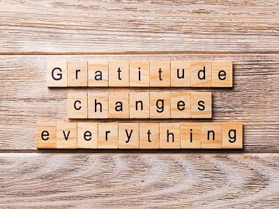 Gratitude changes everything written on wood block