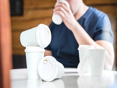 man drinking coffee depicting caffeine addiction