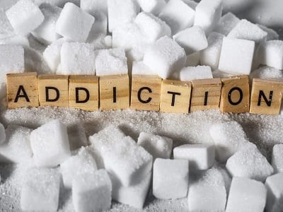 addiction written on sugar cubes