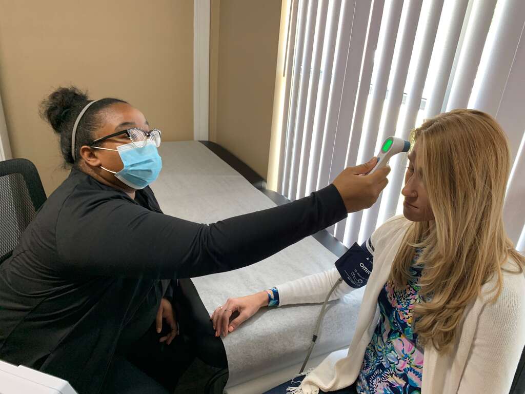 Detox Nurse Taking Temperature | Turning Point of Tampa